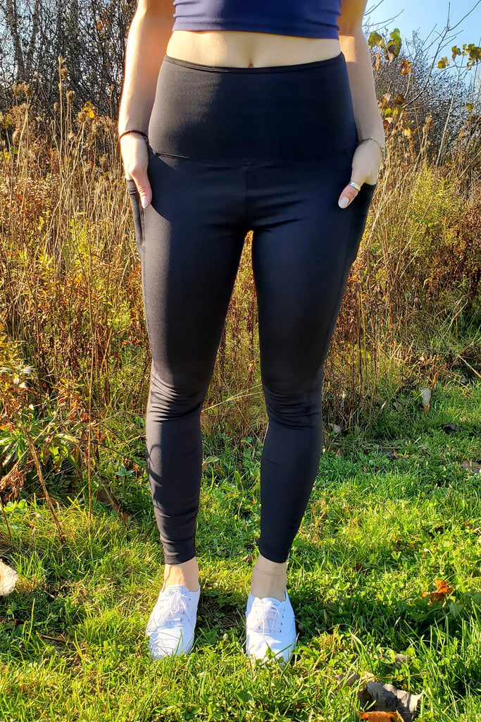 Black yoga pants with figure flattering hemlines, two pockets, standard high waisted, double thickness curved waistband.  Made in Canada