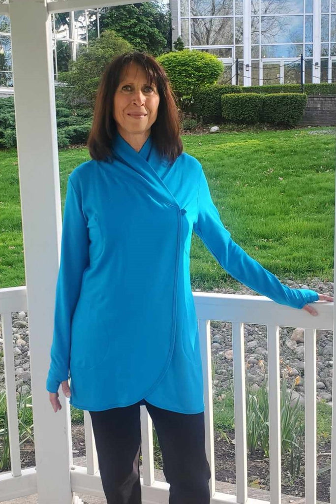 Cocoon wrap for women with pockets, cozy and comfortable to wear, thumb holes in sleeves, turquoise colour.  Made in Canada