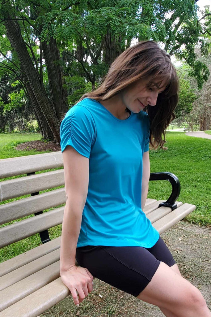 Short sleeve technical fabric tee with crew neck, ruched sleeve detail, blue colour